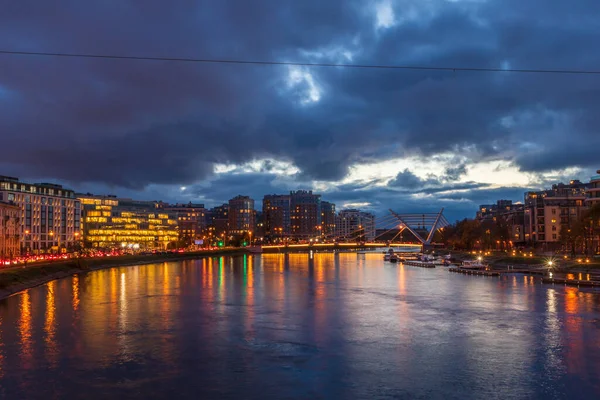 city bridge landscape and office buildings architecture skyline cloeds night