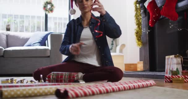 Caucasian Woman Home Christmas Sitting Living Room Floor Wearing Santa — Stock Video