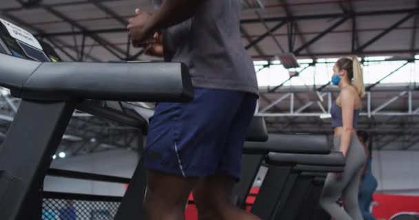 Fit African American Man Wearing Face Mask Headphones Running Treadmill — Stock Video