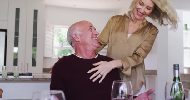 Caucasian Senior Couple Sitting Table Drinking Wine Eating Dinner Hugging — Stock Video