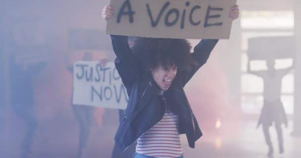 Diverse group of people holding protest signs shouting — Stock Video