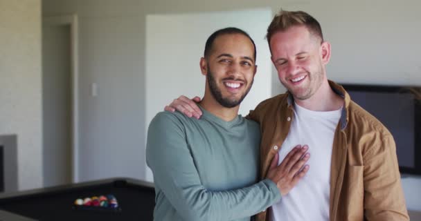 Portrait of multi ethnic gay male couple looking at camera and smiling — Stock Video