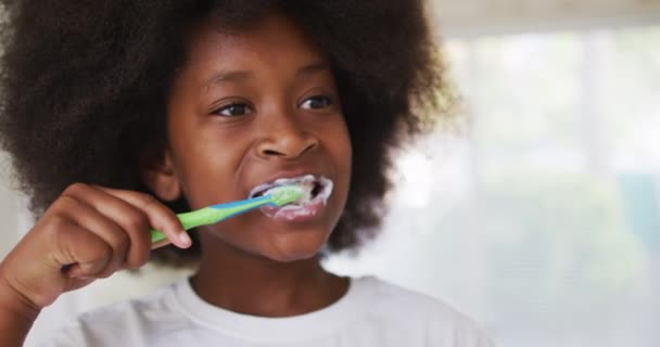 African American Girl Brushing Her Teeth Bathroom Staying Home Self — Stock Video