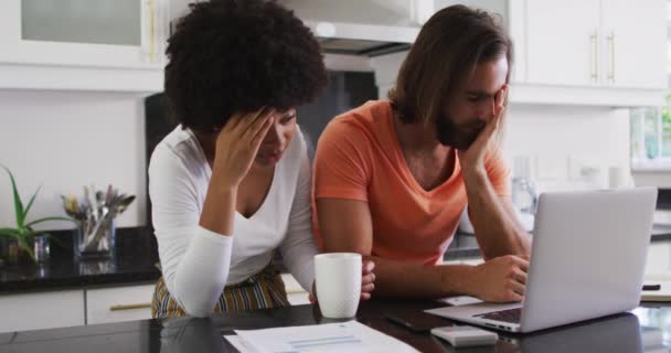 Stressed Mixed Race Couple Using Laptop Calculating Finances Kitchen Home — Stock Video