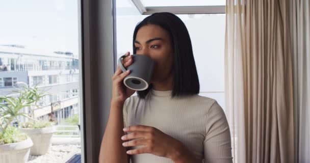 Mixed Race Gender Fluid Person Drinking Cup Coffee Looking Window — Stock Video