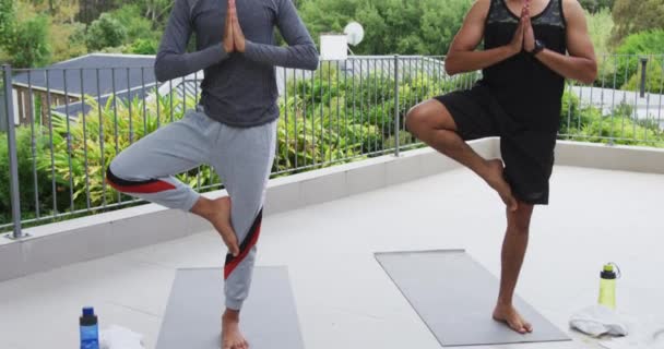 Smiling Mixed Race Gay Male Couple Standing Terrace Practicing Yoga — Stock Video