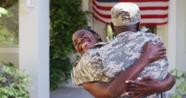 African American Male Soldier Hugging Smiling Wife Front House American — Stock Video