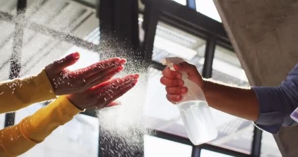 Mixed Race Male Cafe Worker Disinfecting Hands Female Coworker Small — Stock Video