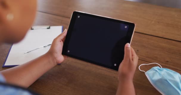 African American Female Doctor Having Video Call Consultation Using Tablet — Stock Video