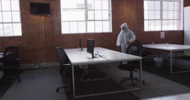 Cleaner Wearing Protective Face Mask Overalls Disinfecting Office Furniture Hygiene — Stock Video