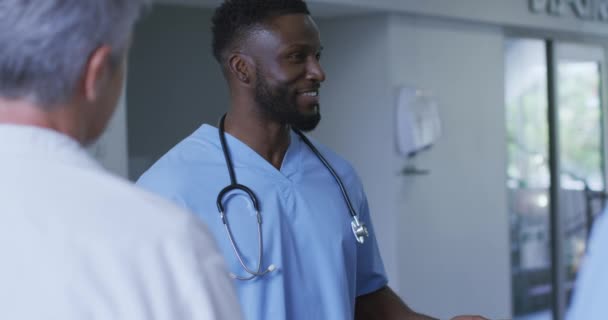 Smiling African American Male Doctor Discussing Diverse Colleagues Hospital Staff — Stock Video