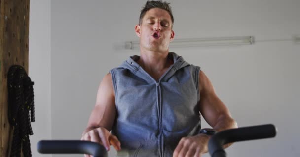 Fit Sweaty Caucasian Man Exercising Training Bike Gym Cross Training — Video