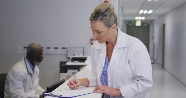 Portrait Caucasian Female Doctor Standing Hospital Reception Smiling Camera Medicine — Stok video