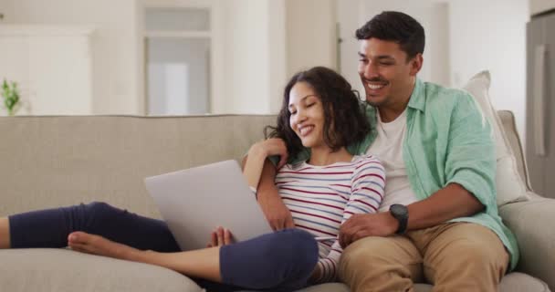 Hispanic Couple Sitting Sofa Looking Laptop Discussing Home Isolation Quarantine — Stock Video
