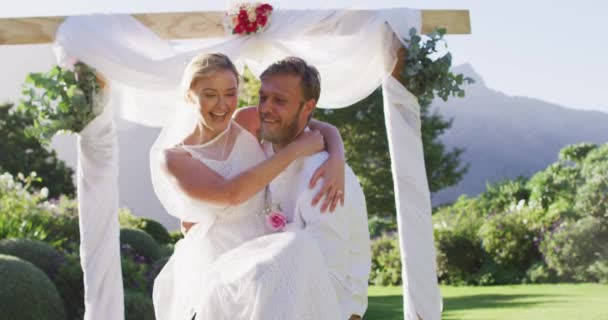 Happy Caucasian Husband Carries Newly Wed Bride Walks Altar Outdoors — Stock Video