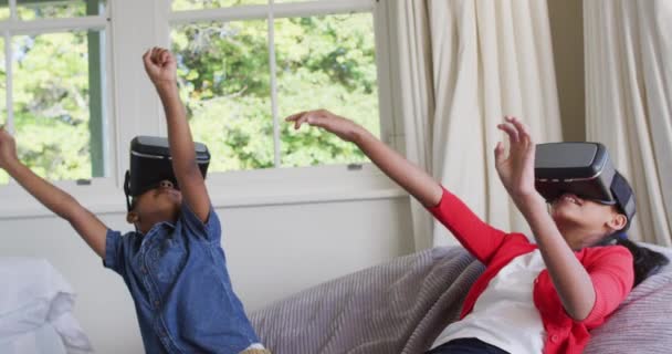 Diverse Boy Girl Sitting Home Sofa Playing Wearing Virtual Reality — Stock Video