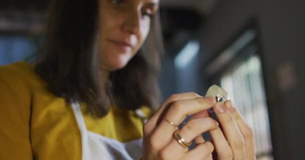 Close Caucasian Female Jeweller Carefully Checking Piece Jewelry Independent Handmade — Vídeo de stock