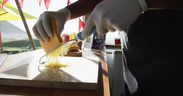 Mid Section African American Man Wearing Gloves Grating Cheese Food — Stock Video