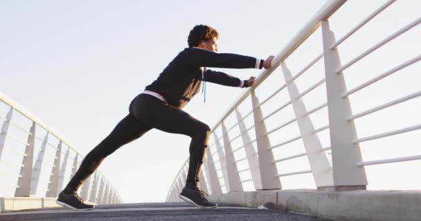 African American Man Stretching Leaning Footbridge Exercising Outdoors Fitness Healthy — Vídeo de stock