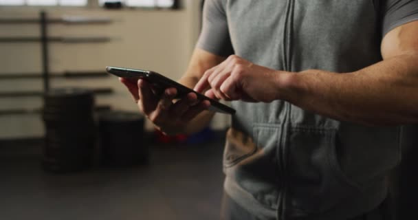 Mid Section Fit Caucasian Man Using Digital Tablet Gym Sports — Vídeos de Stock