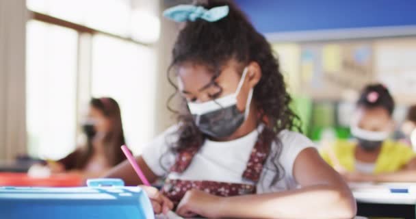 Portrait Mixed Race Schoolgirl Wearing Face Mask Classroom Looking Camera — Stock Video
