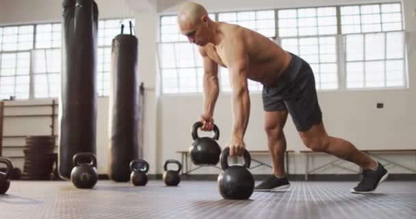 Fit Caucasian Man Working Out Kettle Bells Gym Sports Training — Stock Video