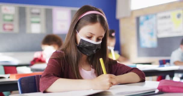 Portrait Caucasian Schoolgirl Wearing Face Mask Classroom Looking Camera Children — Stock Video