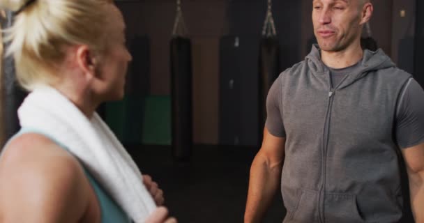 Caucasian Male Trainer Talking Fit Caucasian Woman Gym Sports Training — Vídeos de Stock