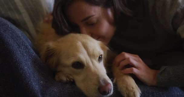 Caucasian Woman Kissing Cuddling Her Pet Dog Sitting Sofa Home — Stock Video