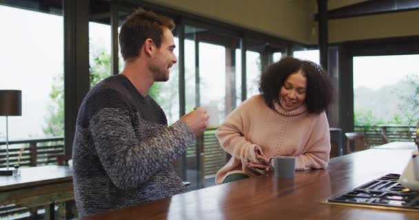 Happy Diverse Couple Talking Drinking Coffee Kitchen Spending Free Time — ストック動画