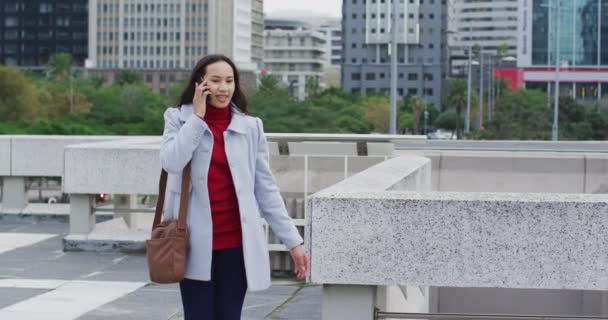 Asian Woman Walking Talking Smartphone Using Smartwatch Digital Nomad Out — Stock Video