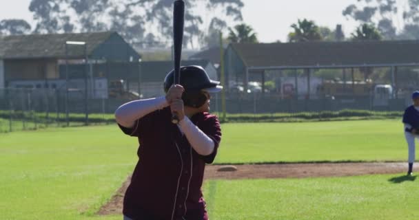 Mixed Race Female Baseball Player Hitter Swinging Bat Pitched Ball — Stock Video