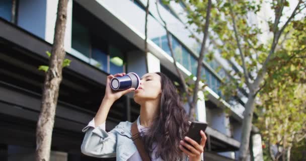 Asian Woman Walking Using Smartphone Drinking Takeaway Coffee Digital Nomad — Stock Video