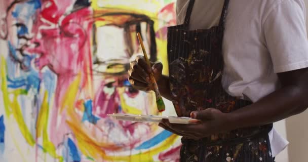 Mid Section African American Male Artist Wearing Apron Painting Canvas — Stock Video