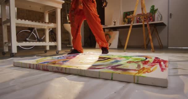 Low Section African American Male Artist Pouring Paint Canvas Art — Stock Video