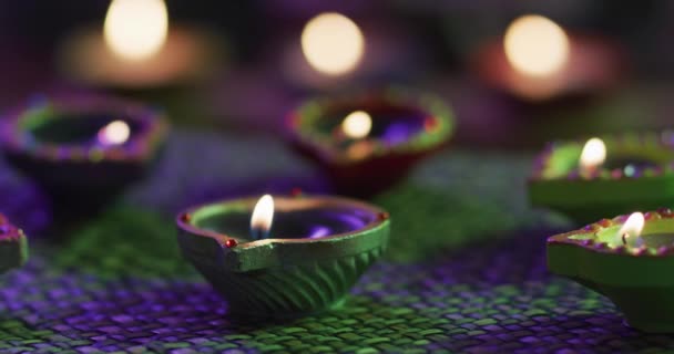 Lit Candles Decorative Clay Pots Woven Table Mat Focus Foreground — Stock Video