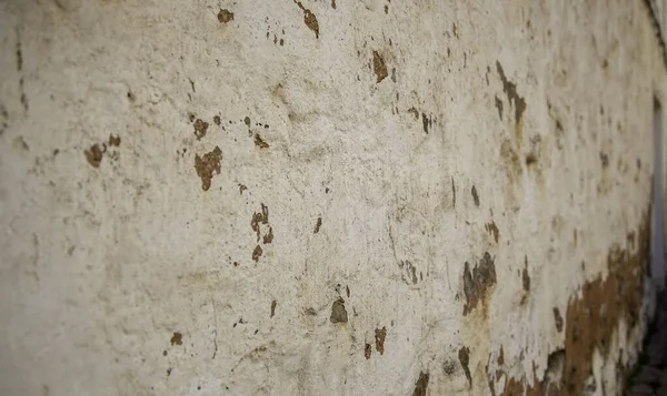 Broken wall with stripes on urban street, construction and architecture, texture