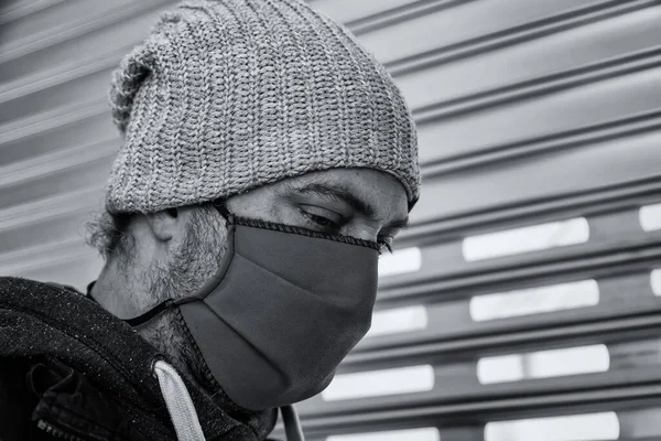 Young street gang with mask in park, social problem