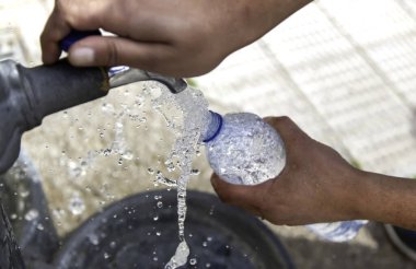 Filling water bottle in fountain, refresh and thirsty clipart