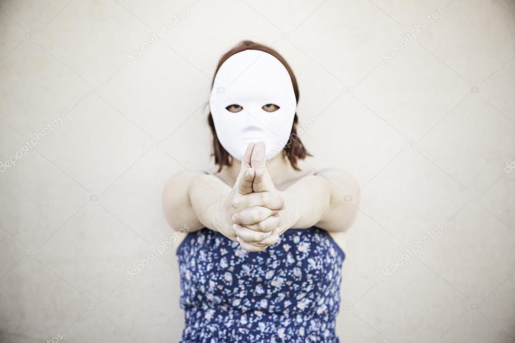 Girl with mask pointing