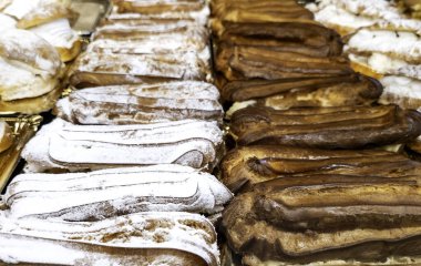 Detail of artisan pastries with whipped cream and sugar