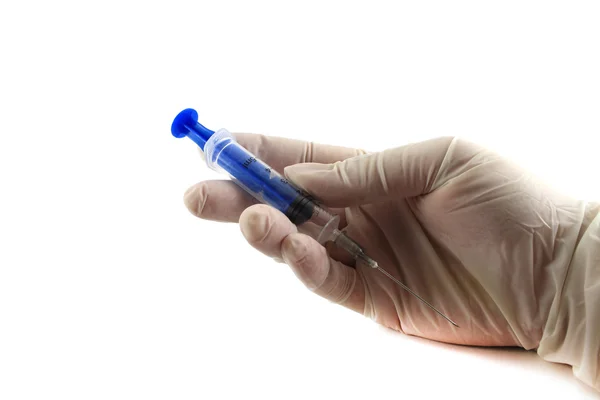 The doctor's hand in glove holding a syringe. Isolated object on — Stock Photo, Image