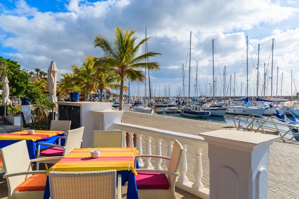 Table with chairs in restaurant in Puerto Calero marina — Φωτογραφία Αρχείου