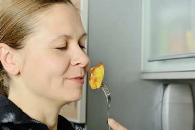 woman smelling a food clipart