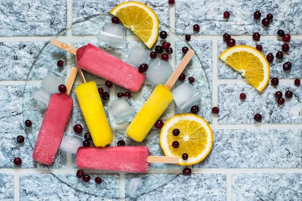 Delicious fruit ice with orange and cranberries — Stock Photo, Image