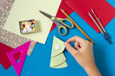 Making Christmas card with voluminous tree. Original project for children. DIY concept. Step-by-step photo instructions. Step 7. Secure folds with thick tape 