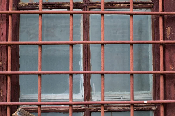 Iron bars on the window — Stockfoto