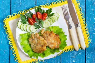 Fresh hot pork cutlets with vegetables 