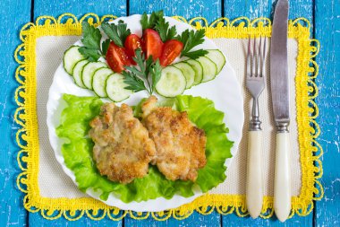 Homemade fried cutlets with tomato and cucumber 