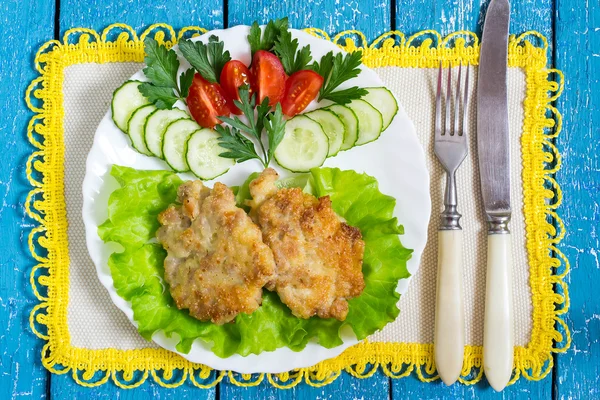 Homemade fried cutlets with tomato and cucumber 